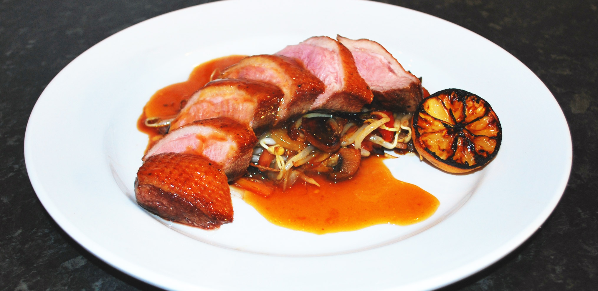 Breast of Duckling in a Sauce of Limes with Oriental Stir Fried Vegetables
